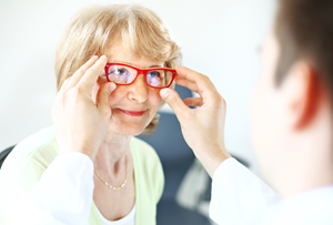 senior woman getting fitted for glasses
